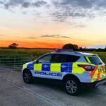 rural crime image - police car sunset